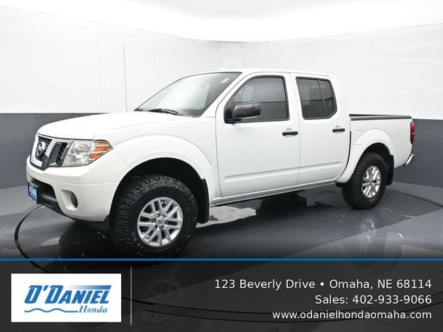 2014 Nissan Frontier SV in Glacier White — front three-quarter view