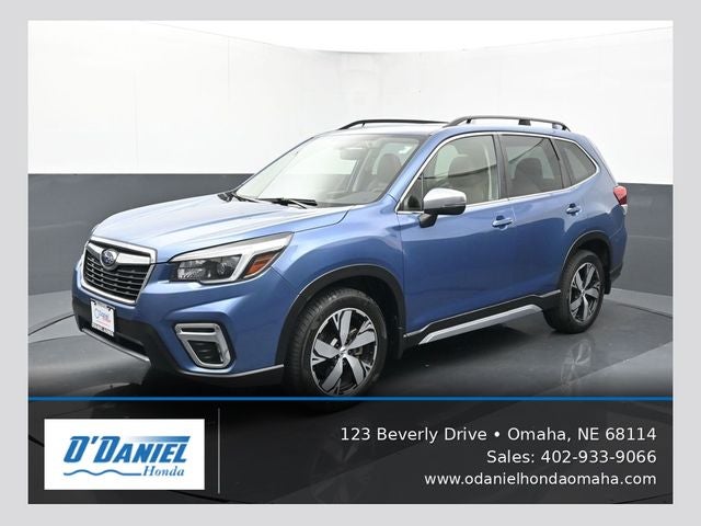 2021 Subaru Forester Touring in Horizon Blue Pearl — front three-quarter view
